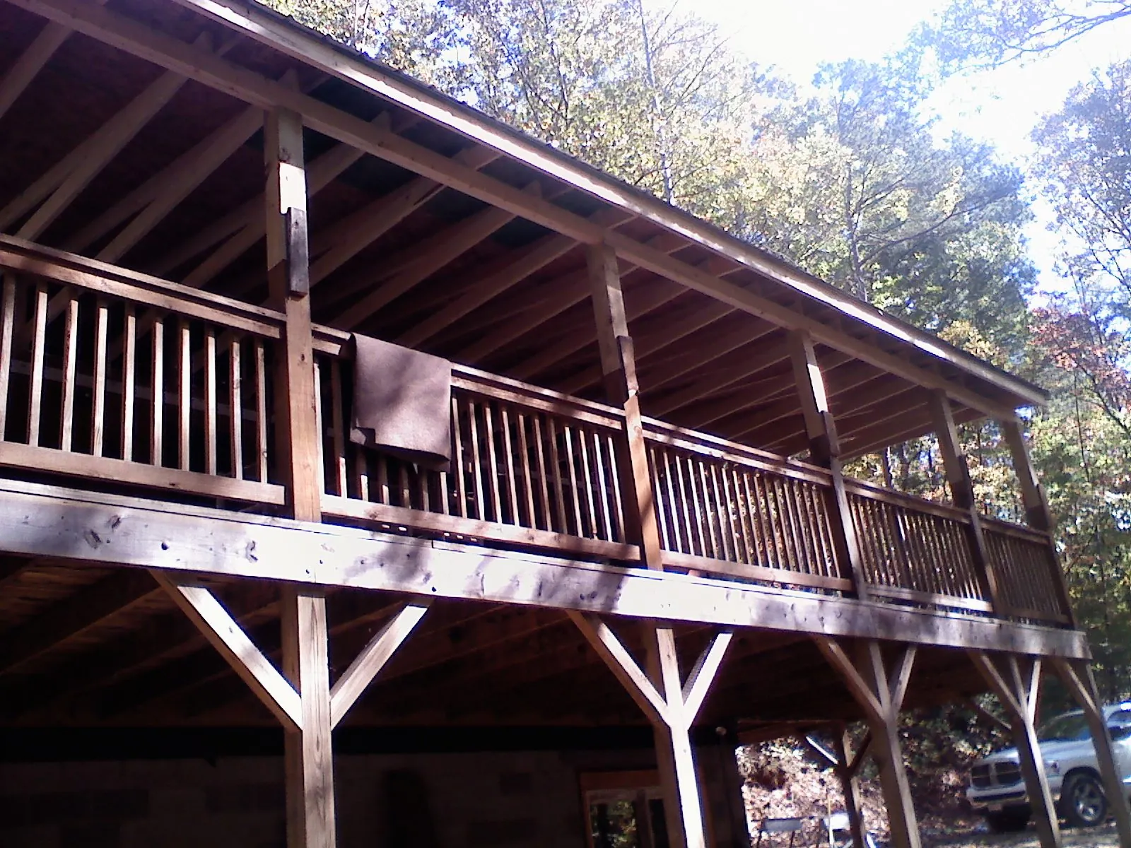 Timber framing under a new elevated porch and deck — Roof Leak Repair in New Marshfield by Roofing Brothers